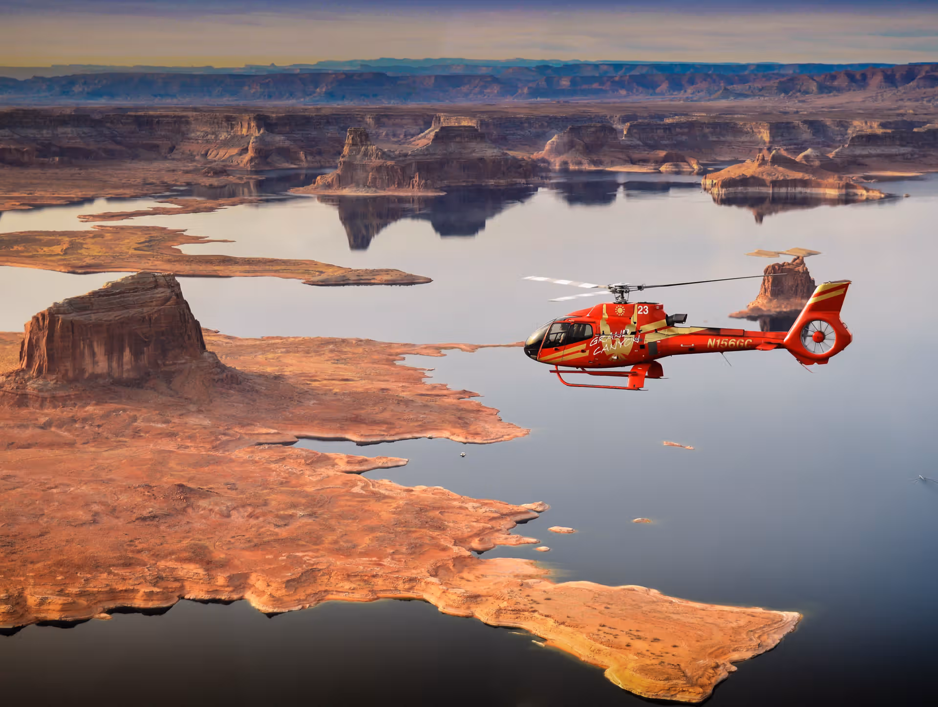 Red helicopter flying over Lake Powell from Page, Arizona
